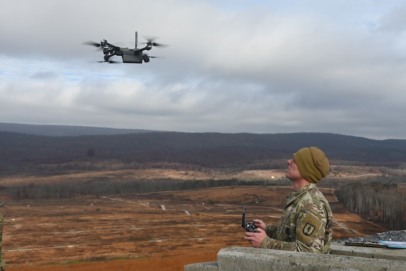 Sgt. 1st Class Richard Hutnik, quality assurance noncommissioned officer for the 166th Regiment – Regional Training Institute’s 1st Battalion, uses a drone to acquire targeting data Nov. 15, 2024, at Fort Indiantown Gap, Pa. This data was used to submit a call for fire to instructors and students with 2nd Battalion, who engaged the targets with artillery fire using M119, M777, and M109A6 howitzers. (Pennsylvania National Guard photo by Brad Rhen)