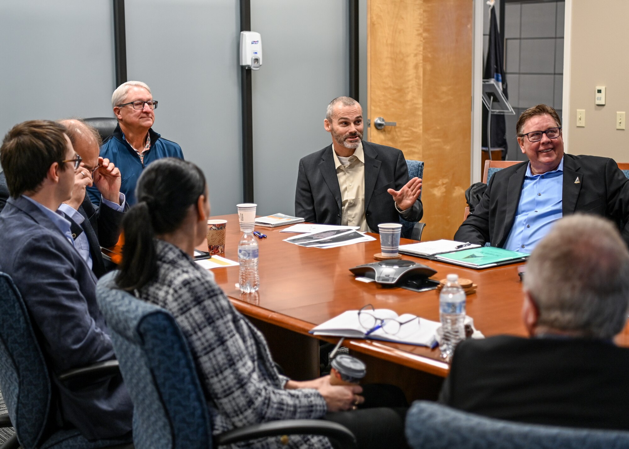 A Norwegian Armed Forces member gives a mission brief to a Space Systems Command Launch Enterprise Executive Director and members of Space Launch Delta 30 during a visit at Vandenberg Space Force Base.