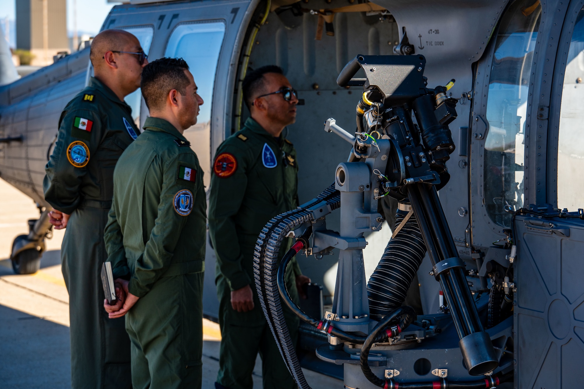 Photos of airplanes and crews participating in AMALGAM EAGLE 2024, a live-fly air defense exercise