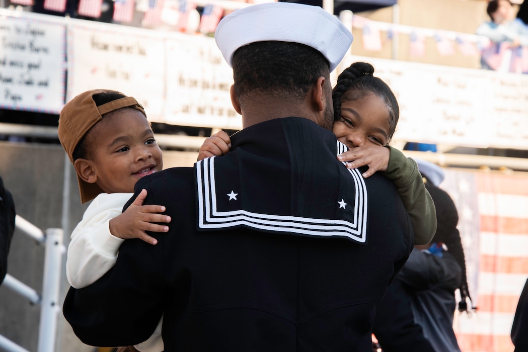 Sailors assigned to the Nimitz-class aircraft carrier USS George Washington (CVN 73) embraced family members on the pier during a homecoming onboard Commander, Fleet Activities Yokosuka Friday, November 22. George Washington returned to Yokosuka for the first time in almost nine years after turning over with USS Ronald Reagan (CVN 76) as the Navy’s only permanently forward-deployed aircraft carrier. George Washington is 7th Fleet's premier forward-deployed aircraft carrier, a long-standing symbol of the United States' commitment to maintaining a free and open Indo-Pacific region, while operating alongside Allies and partners across the U.S. Navy's largest numbered fleet.