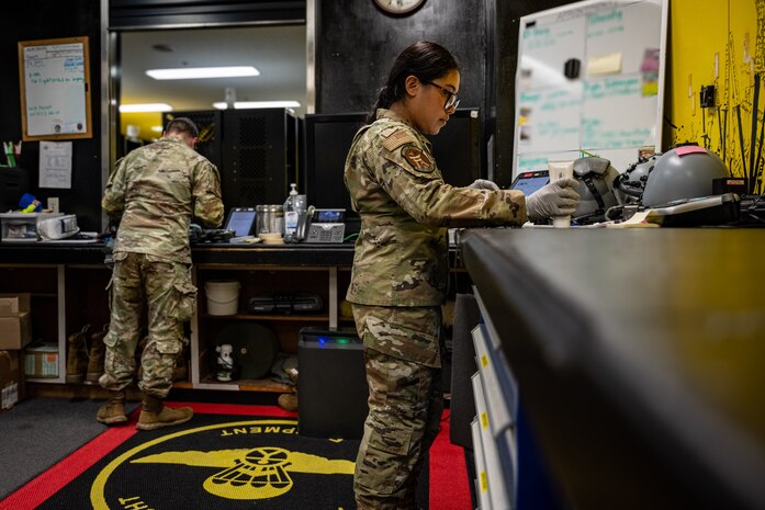 Airman cleans parts