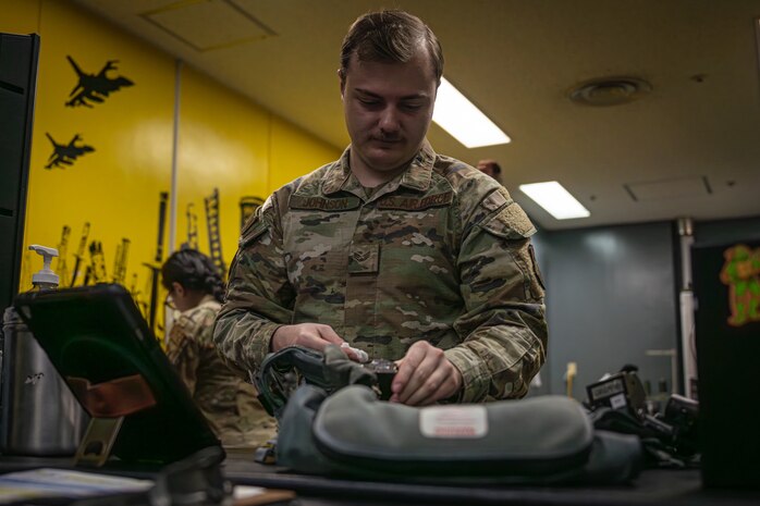 Airman sews life saving vest