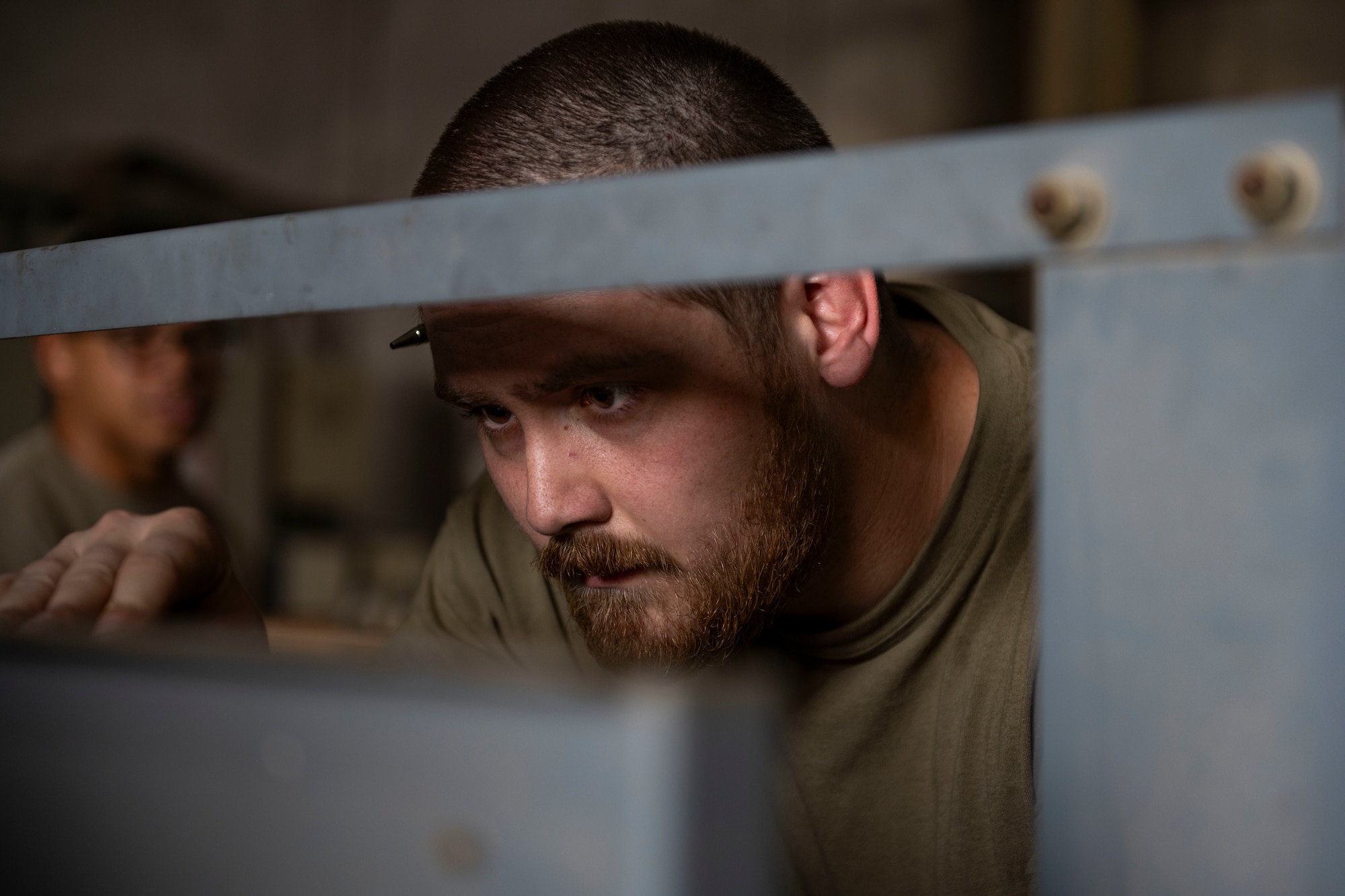Airmen work on equipment.
