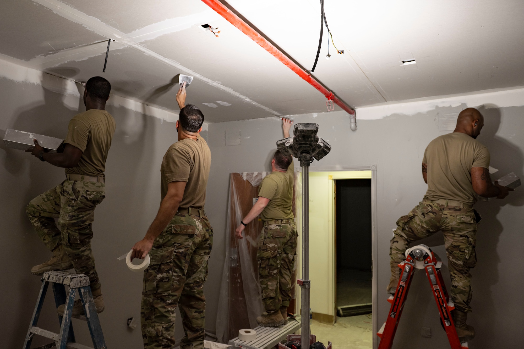 Airmen fix dorm.