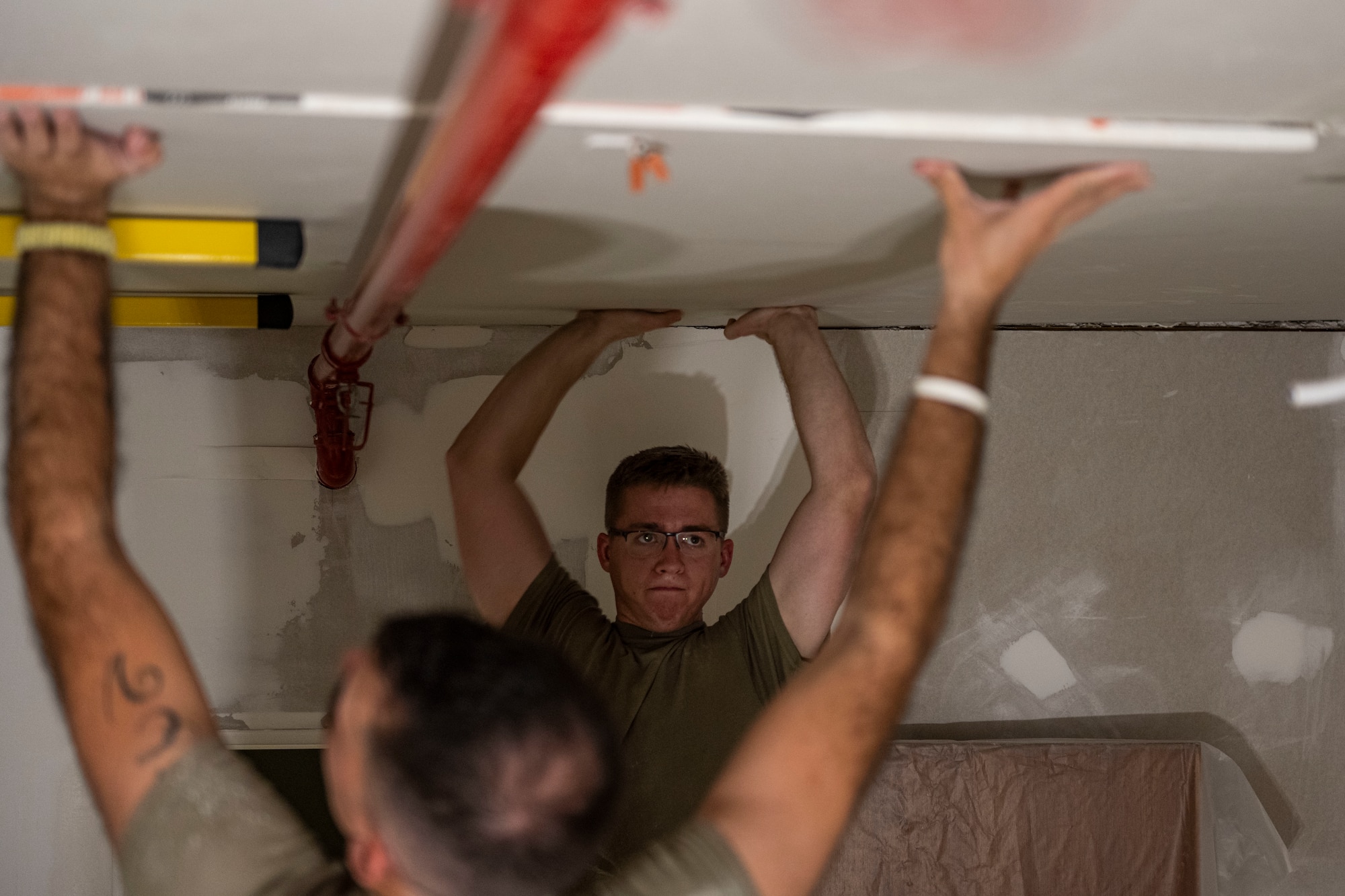 Airmen fix dorm.