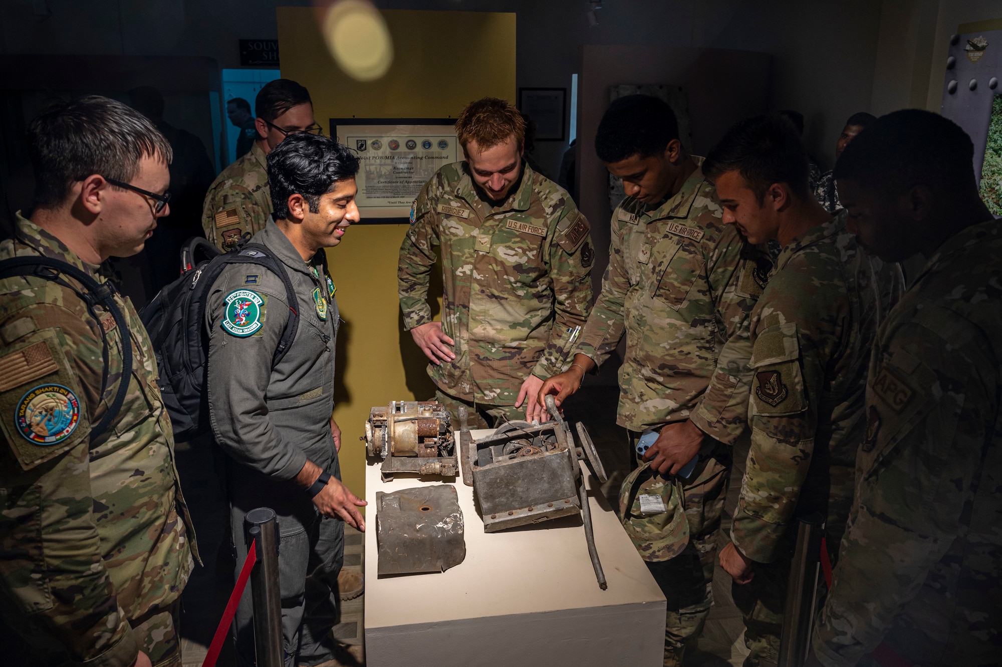 Members assigned to the 25th Fighter Generation Squadron and 25th Fighter Squadron examine an artifact during “The Hump WWII Museum Pasighat” museum visit at Assam, India, Sept. 15, 2024. The name ‘Assam Draggins’ was born on Oct. 10, 1942. During their visit, the 25th FS and 25th FGS reflect on their unrivaled experiences and share valuable stories highlighting not only their past but their present. (U.S. Air Force photo by Senior Airman Sabrina Fuller-Judd)