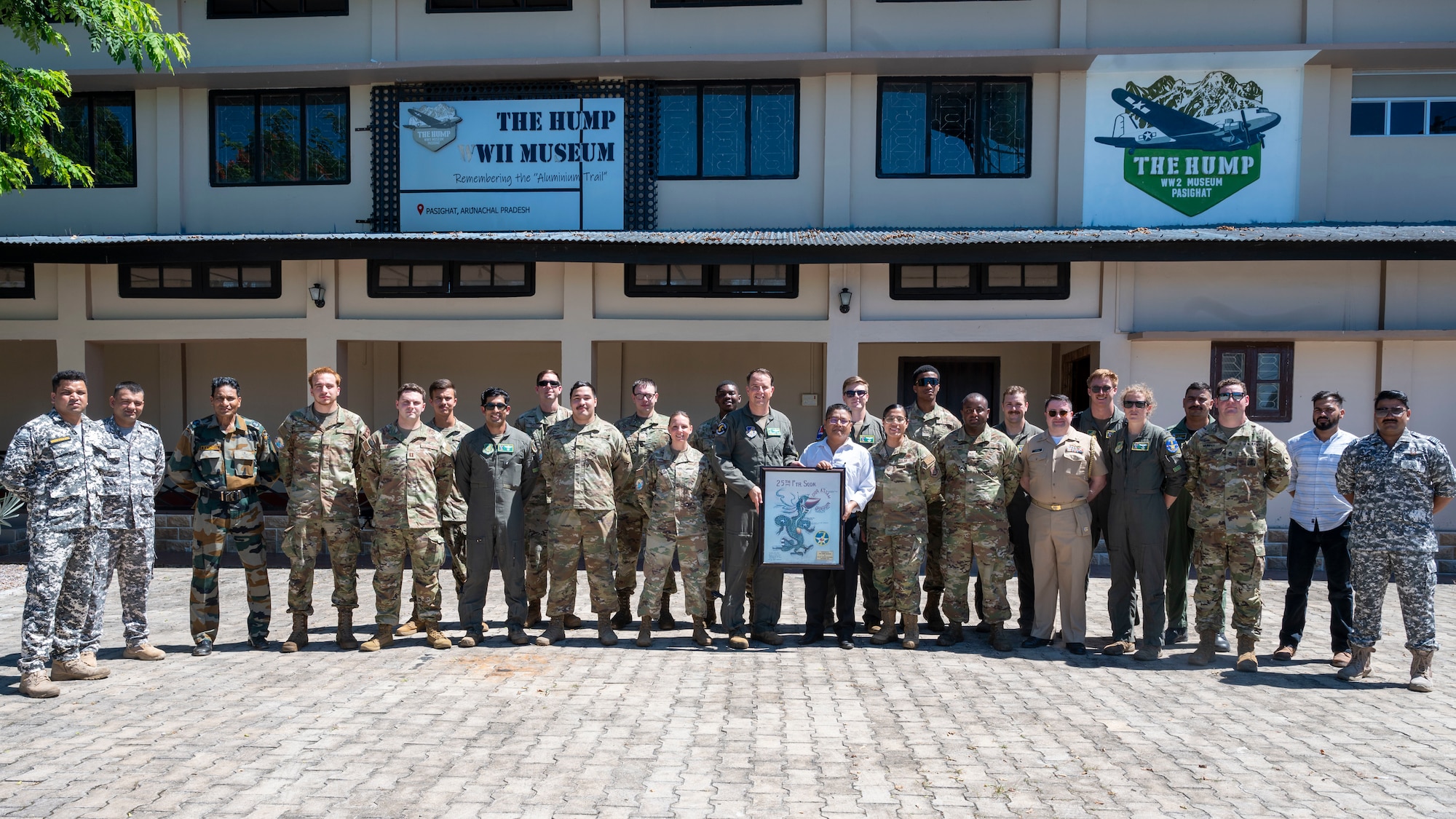 U.S. Air Force 25th Fighter Squadron and 25th Fighter Generation Squadron members pose with a U.S. Assistant Naval Attache, Indian Air Force members and museum curators for a photo at the “The Hump WWII Museum Pasighat” during their visit to Assam, India, Sept. 15, 2024. Their visit celebrated the enduring partnership between the U.S. and India and their mission to expand interoperability and ensure a safe, secure, and open Indo-Pacific. The museum is dedicated to honoring the history and dedication of India’s service members and allies during World War II. (U.S. Air Force photo by Senior Airman Sabrina Fuller-Judd)