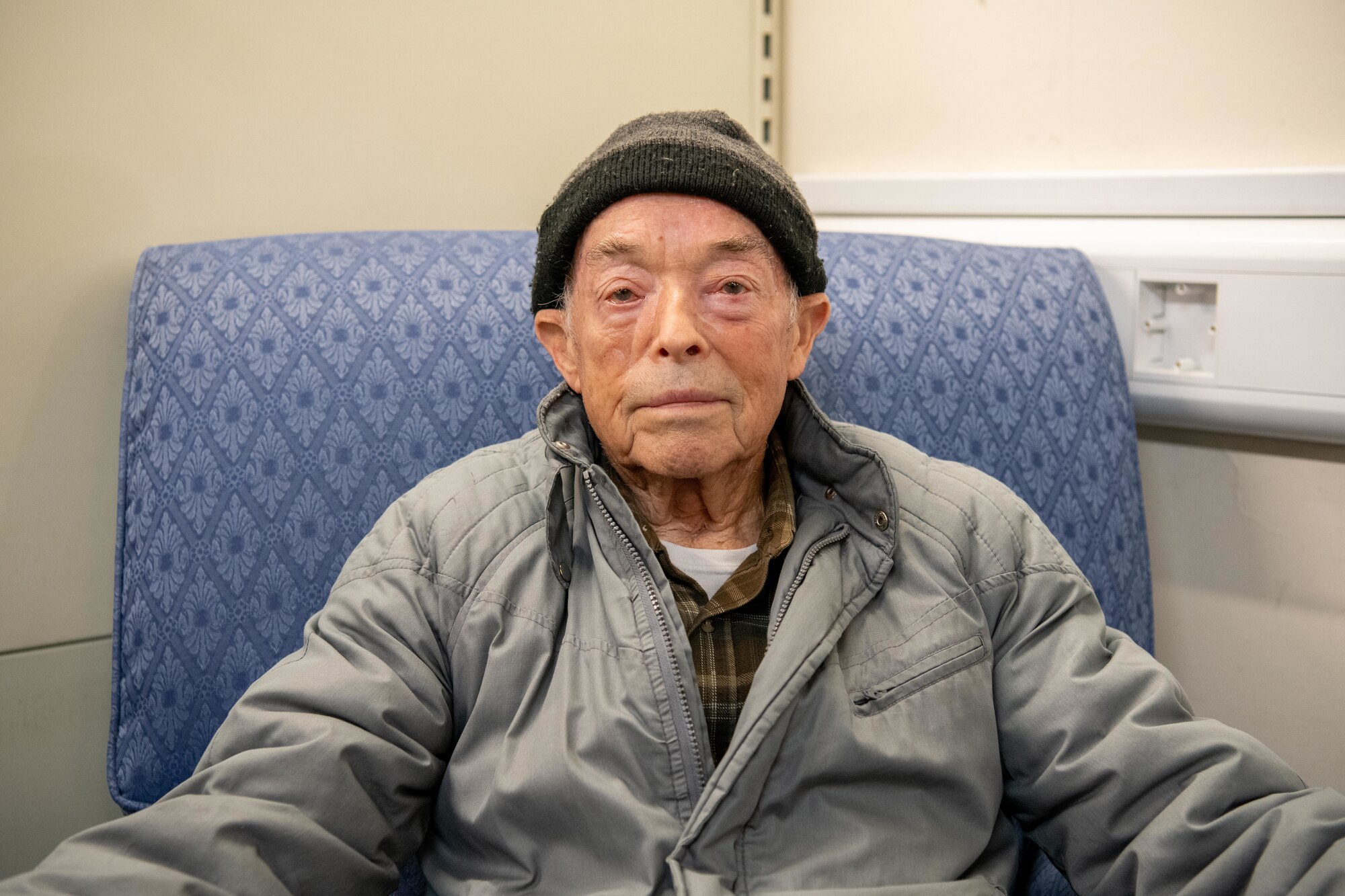 Mr. Simon Martin sits in a chair