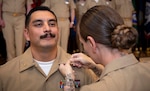 240927-N-KC192-1060 PORTSMOUTH, Va. (Sept. 27, 2024) Chief Hospital Corpsman (Select) Eric Garcia, assigned to Navy and Marine Corps Public Health Force Protection Command, is pinned to the rank of Chief Petty officer by his wife, Chief Hospital Corpsman (Select) Jessica Garcia, assigned to Navy Medicine Readiness and Training Command (NMRTC) Portsmouth, during  a chief pinning ceremony held on board Naval Support Activity (NSA) Hampton Roads - Portsmouth Annex, Sept. 27, 2024. During the ceremony, key speakers imparted the importance of resiliency and how deckplate leaders can better foster a positive environment for their Sailors to succeed. (U.S. Navy photo by Mass Communication Specialist 2nd Class Levi Decker)