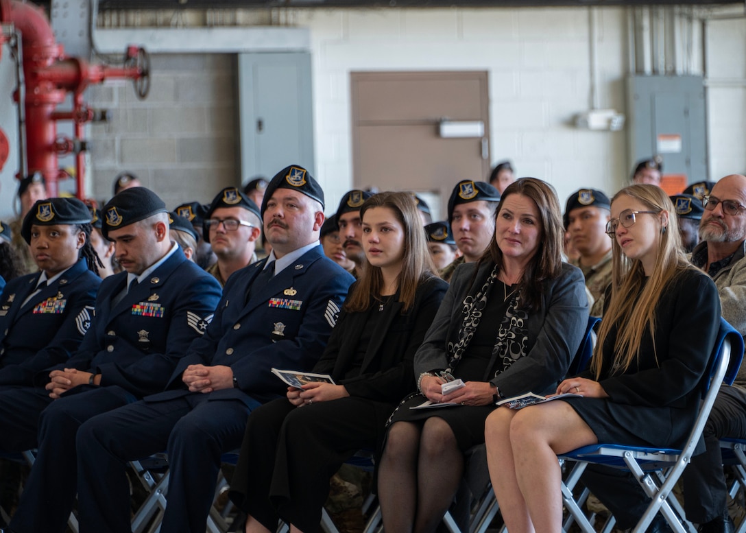 U.S. Air Force Airmen assigned to the 316th Security Forces Squadron and immediate family members attend the memorial service for Staff Sgt. Bailey Behzadi at Joint Base Andrews, Md., Oct. 21, 2024. Survived by his family, friends, and his Air Force community, Behzadi will be remembered for his infectious positivity, dedication to people, and commitment to excellence. (U.S. Air Force photo by Staff Sgt. Aubree Owens)