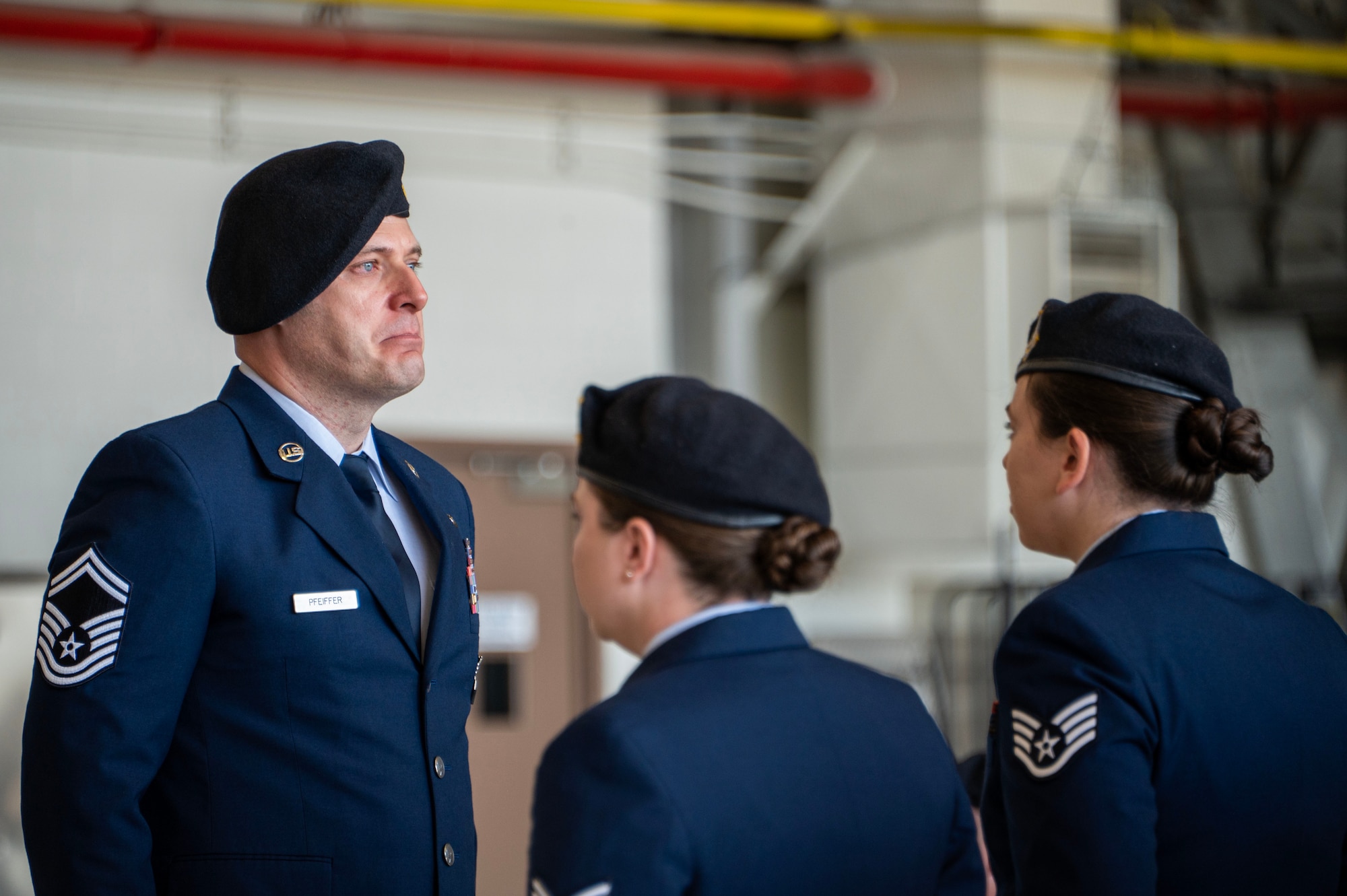 U.S. Air Force Senior Master Sgt. Christopher Pfeiffer, 316th Security Forces Squadron operations superintendent, conducts roll call during the memorial service for Staff Sgt. Bailey Behzadi at Joint Base Andrews, Md., Oct. 21, 2024. During roll call, the names of Echo Flight were called, with each responding "here," until Behzadi’s name was called three times without answer, signifying his absence. (U.S. Air Force photo by Staff Sgt. Aubree Owens)