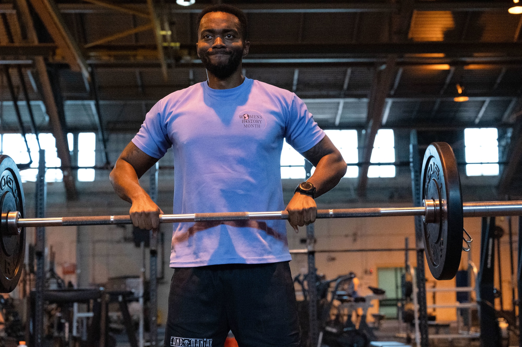 U.S. Air Force Tech. Sgt. Darius Lester, 42nd Comptroller Squadron, finance flight chief prepares to press a barbell over his head during GRIT Week at Maxwell Air Force Base, Ala, Nov. 19, 2024. The physical fitness competition consisted of deadlifts, push-ups, burpees, running, hand release pushups, sit-ups and other exercises.