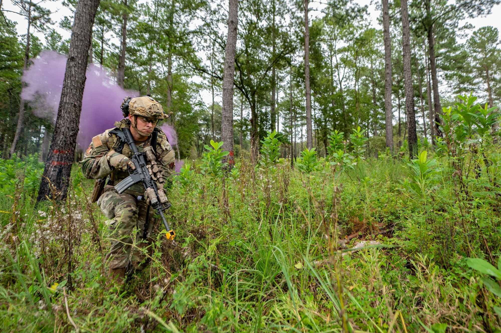 Airman runs through field