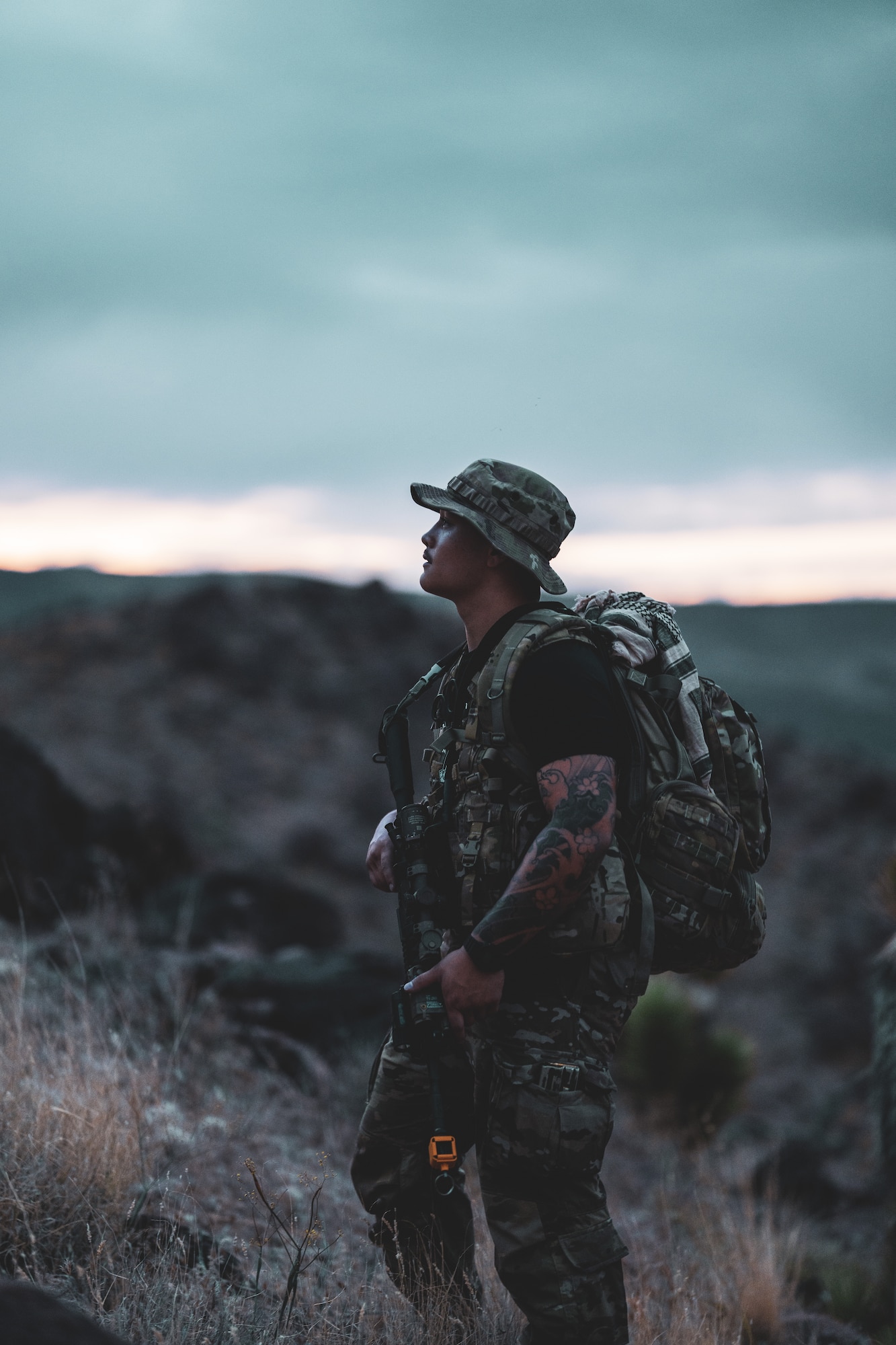 Airman stands on hill