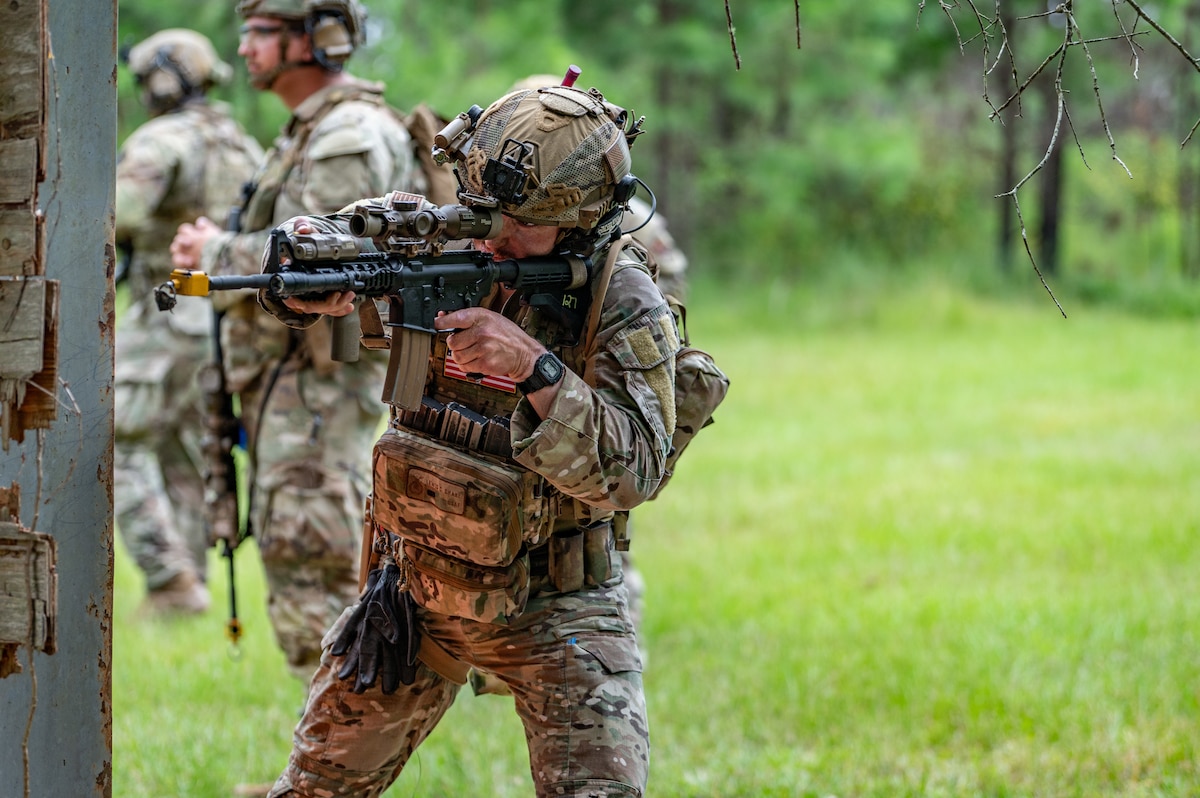 Airman aims rifle