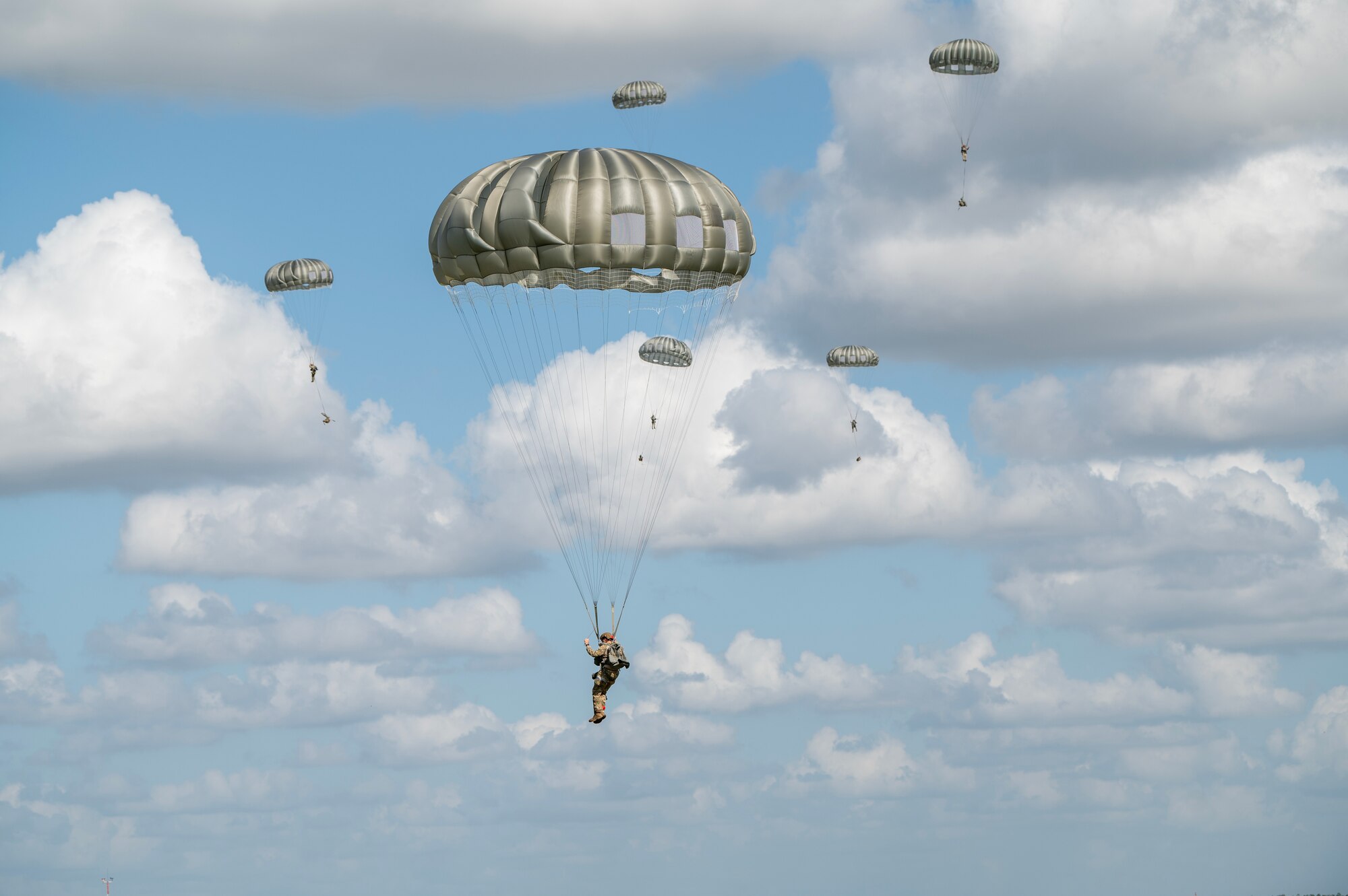Airmen parachute