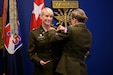 U.S. Army Maj. Gen. Michelle Link, commanding general, 75th U.S. Army Reserve Innovation Command, presents the Basic Aviator Badge with the Astronaut Device to Maj. Kathleen Rubins, a NASA astronaut, during an awards ceremony at the Pentagon, Arlington, Va., Nov. 21, 2024. Rubins underwent intensive instruction on international space station systems, space walks, robotics, physiological training, and flight training at Naval Air Station Whiting Field and NASA in addition to extensive water, land, and winter survival training. (U.S. Army photo by Sgt. Daniel Hernandez)