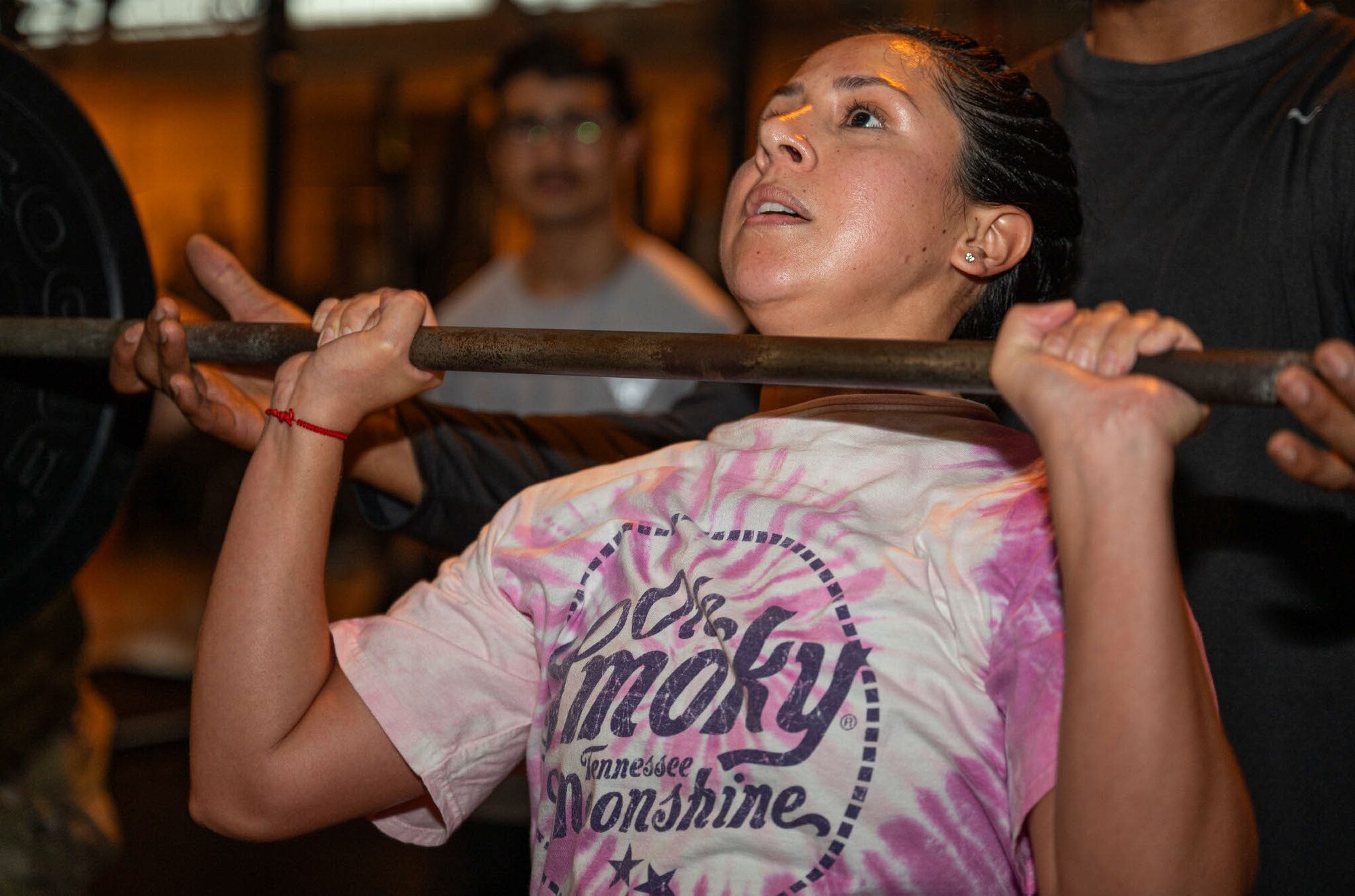 U.S. Air Force Staff Sgt. Nathaly Bustamante Castillo, 42nd Force Support Squadron non-commissioned officer in charge presses a barbell overhead during GRIT Week at Maxwell Air Force Base, Ala, Nov. 18, 2024. The physical fitness competition consisted of deadlifts, push-ups, burpees, running, hand release pushups, sit-ups and other exercises.