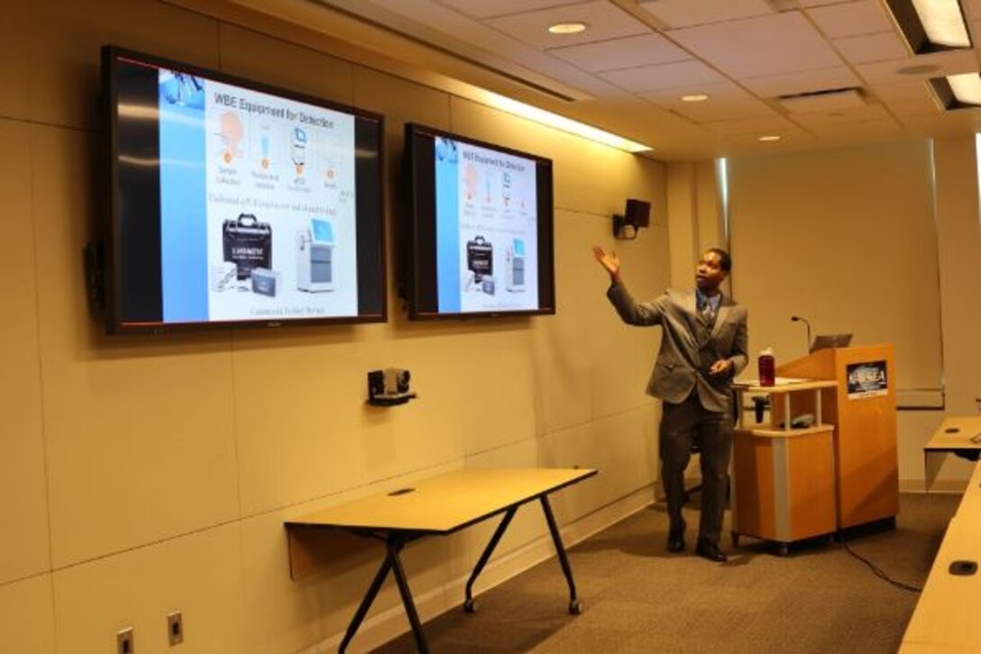 Associate Professor of Environmental Engineering Dr. Erick Butler from the West Texas A and M University in Canyon, Texas, presenting a lecture on the results of two projects he worked on at Naval Surface Warfare Center, Carderock Division on July 16, 2024, in West Bethesda, Maryland.