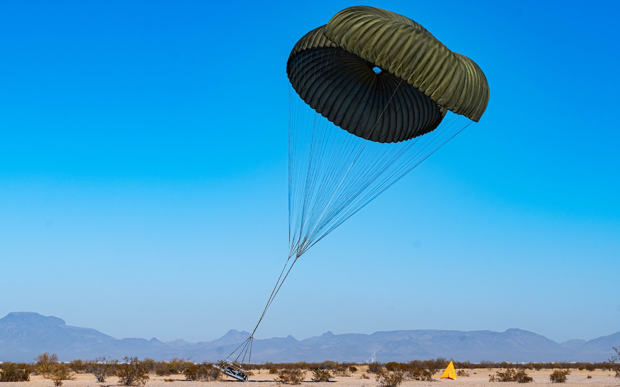 U.S. Marine Corps KC-130J aircraft conducts airdrops of equipment.