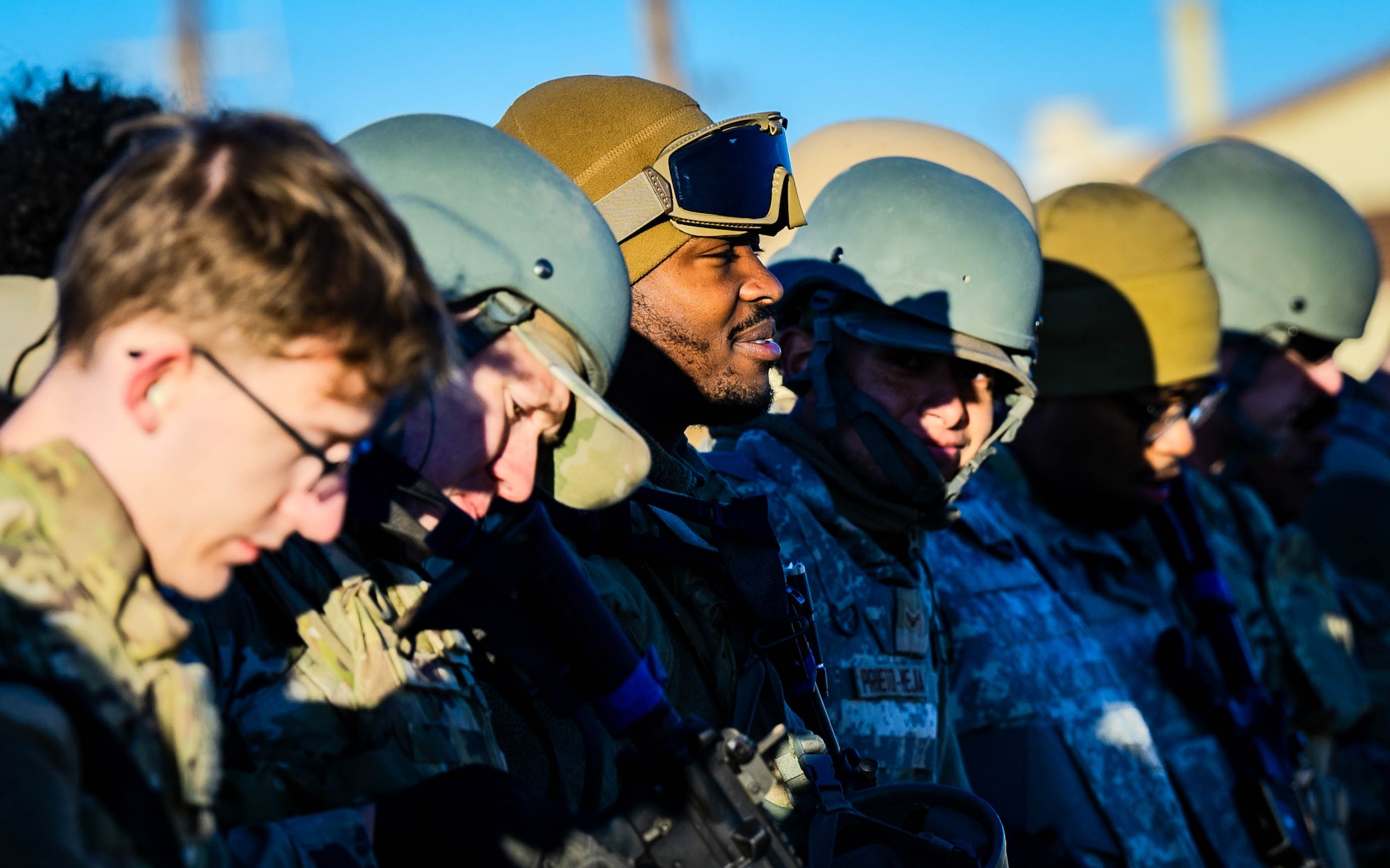 U.S. Air Force Airmen assigned to the 56th Fighter Wing stand by as U.S. Army Sikorsky UH-60 Black Hawks prepare for flight.