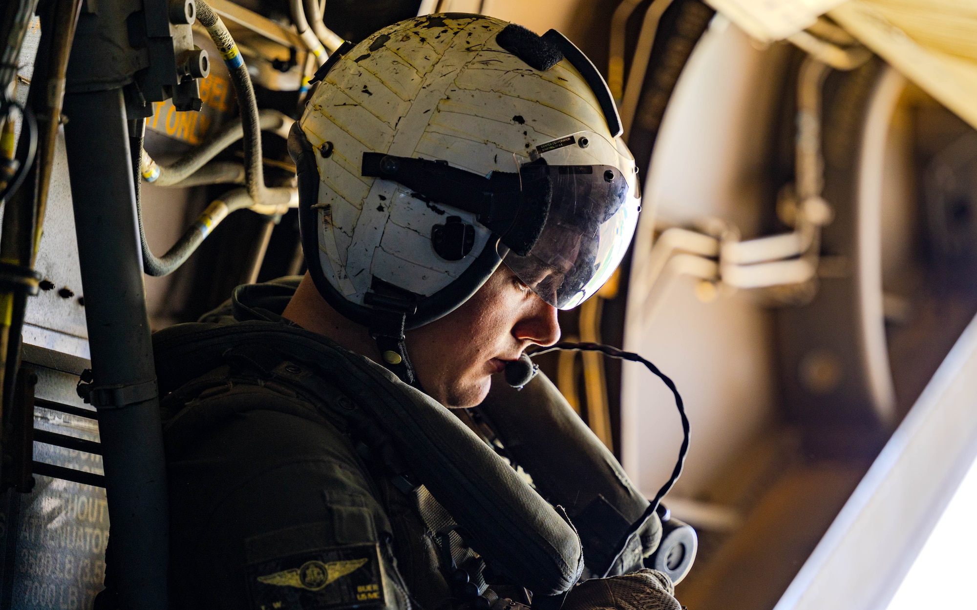 U.S. Marine Corps Cpl. Tyler Buer, Marine Medium Tiltrotor Squadron 163, Marine Aircraft Group 16, 3rd Marine Aircraft Wing, MV-22 Tiltrotor Crew Chief, rides aboard an MV-22 Osprey.
