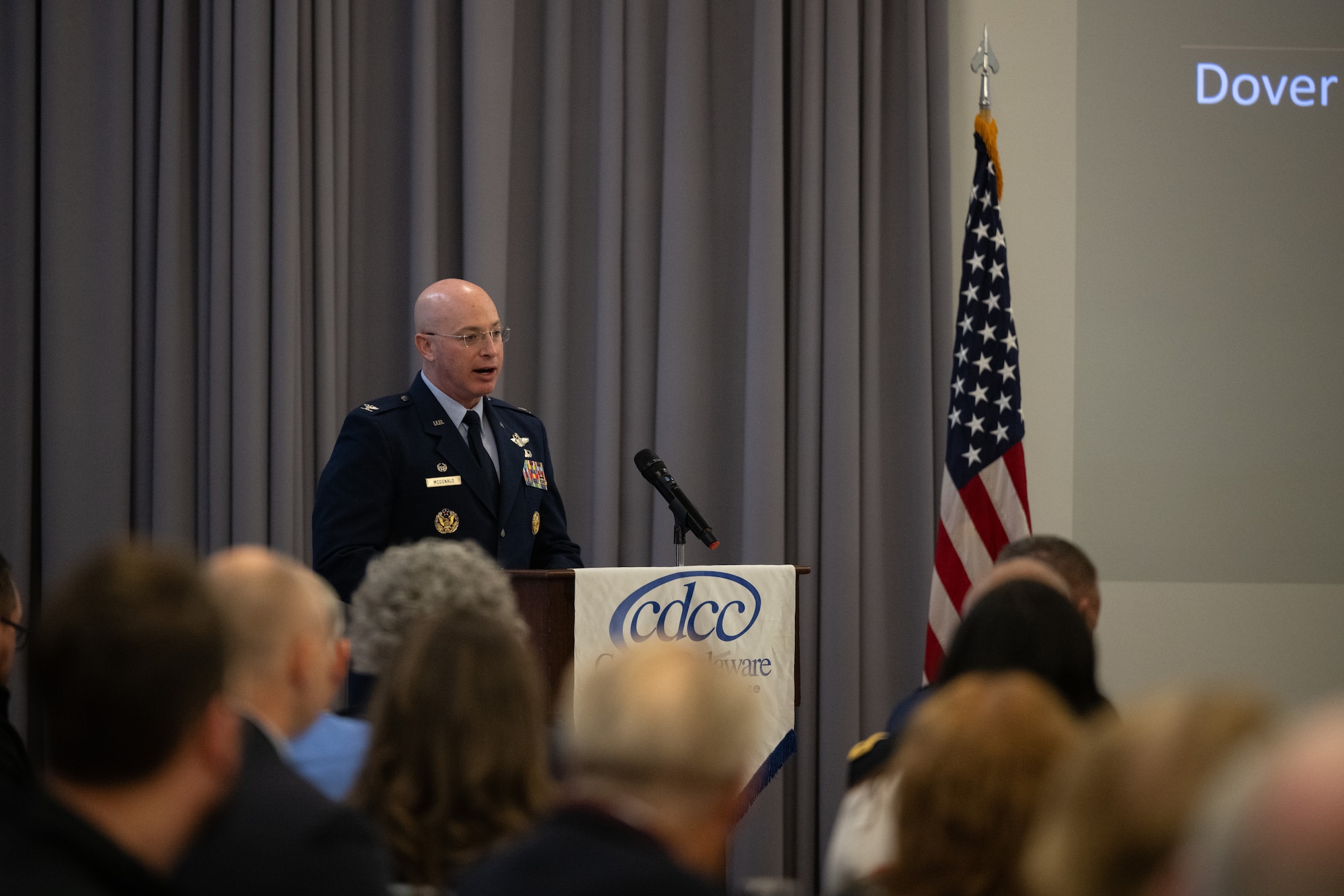 U.S. Air Force Col. Chris McDonald, 436th Airlift Wing commander, presents a 2024 State of the Base update at The Landings Club on Dover Air Force Base, Delaware, Nov. 25, 2024. The event, hosted by the Central Delaware Chamber of Commerce, provided an opportunity to highlight the accomplishments of Team Dover Airmen and show how the Dover community ties into the base's mission, vision and priorities. (U.S. Air Force photo by Airman 1st Class Liberty Matthews)