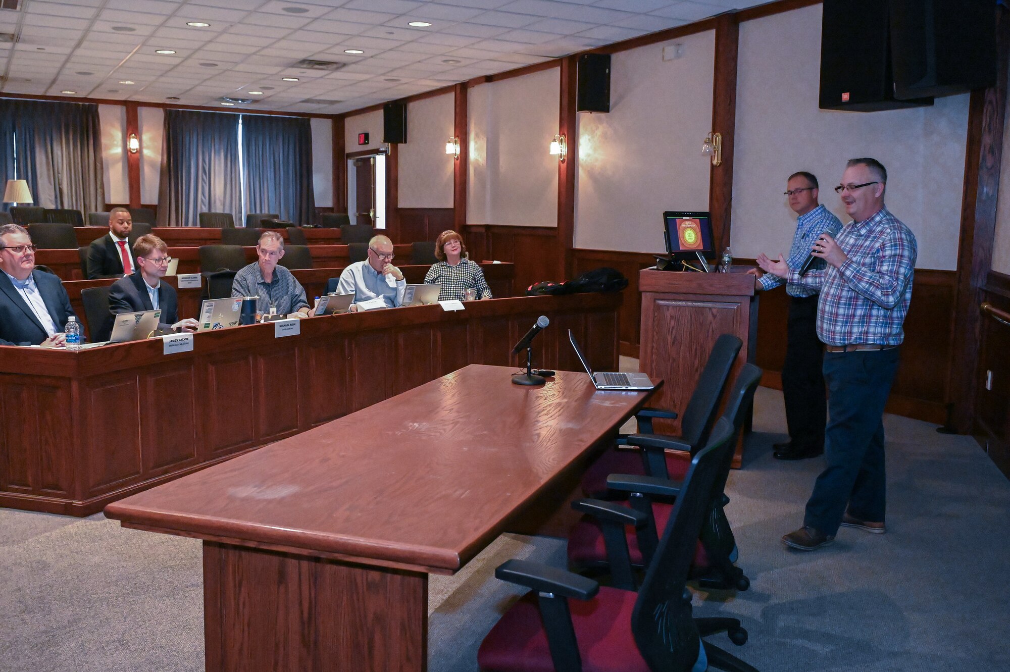 Speaker addressing conference room