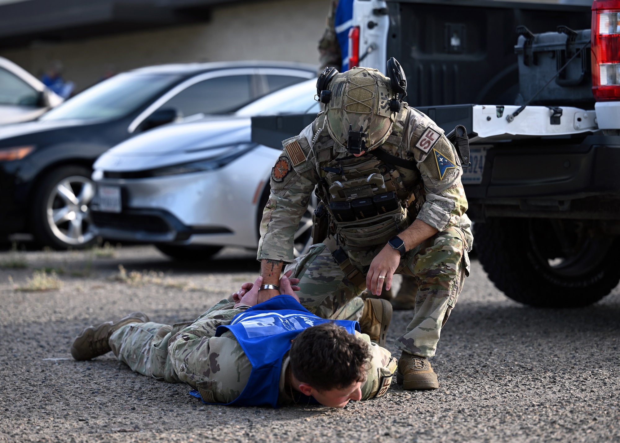 Patrolman apprehends a simulated active shooter during an active shooter exercise.