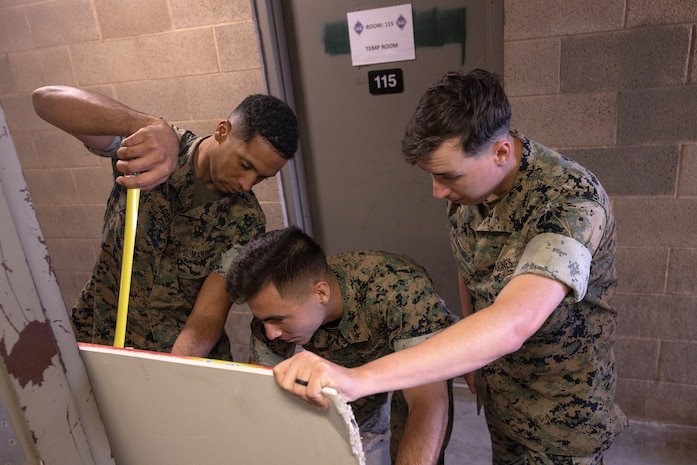 U.S. Marines with 1st Combat Engineer Battalion measure drywall during Operation Clean Sweep at Marine Corps Base Camp Pendleton, Calif., Oct. 29, 2024. Operation Clean Sweep is a joint initiative between Marine Corps Installations West and I Marine Expeditionary Force at Marine Corps Base Camp Pendleton to improve living conditions for Marines and Sailors.