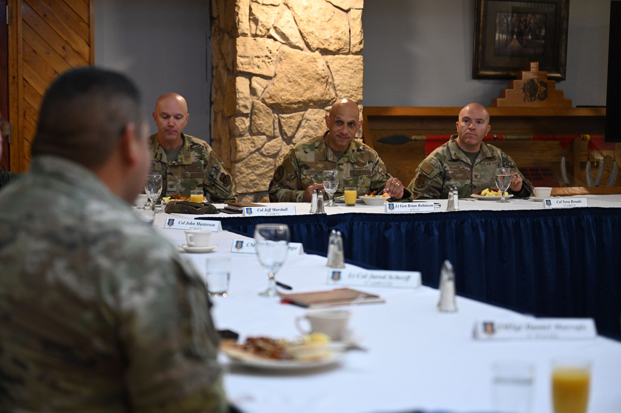 U.S. Air Force Lt. Gen. Brian S. Robinson, commander of the Air Education and Training Command, speaks to 97th Air Mobility Wing leadership during a breakfast at Club Altus on Altus Air Force Base (AFB), Oklahoma, Nov. 20, 2024.