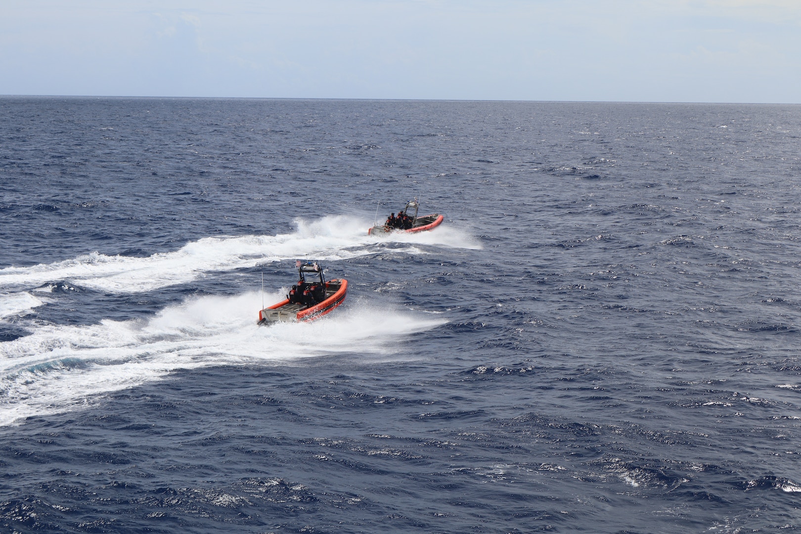 Coast Guard Cutter Vigilant's (WMEC 617) small boats pursue suspected drug smugglers, Nov. 6, 2024, while underway in the Caribbean Sea. Vigilant's crew conducted a 54-day patrol in the Florida Straits and Caribbean Sea. (U.S. Coast Guard photo by Petty Officer 2nd Class Evan Tellado.)