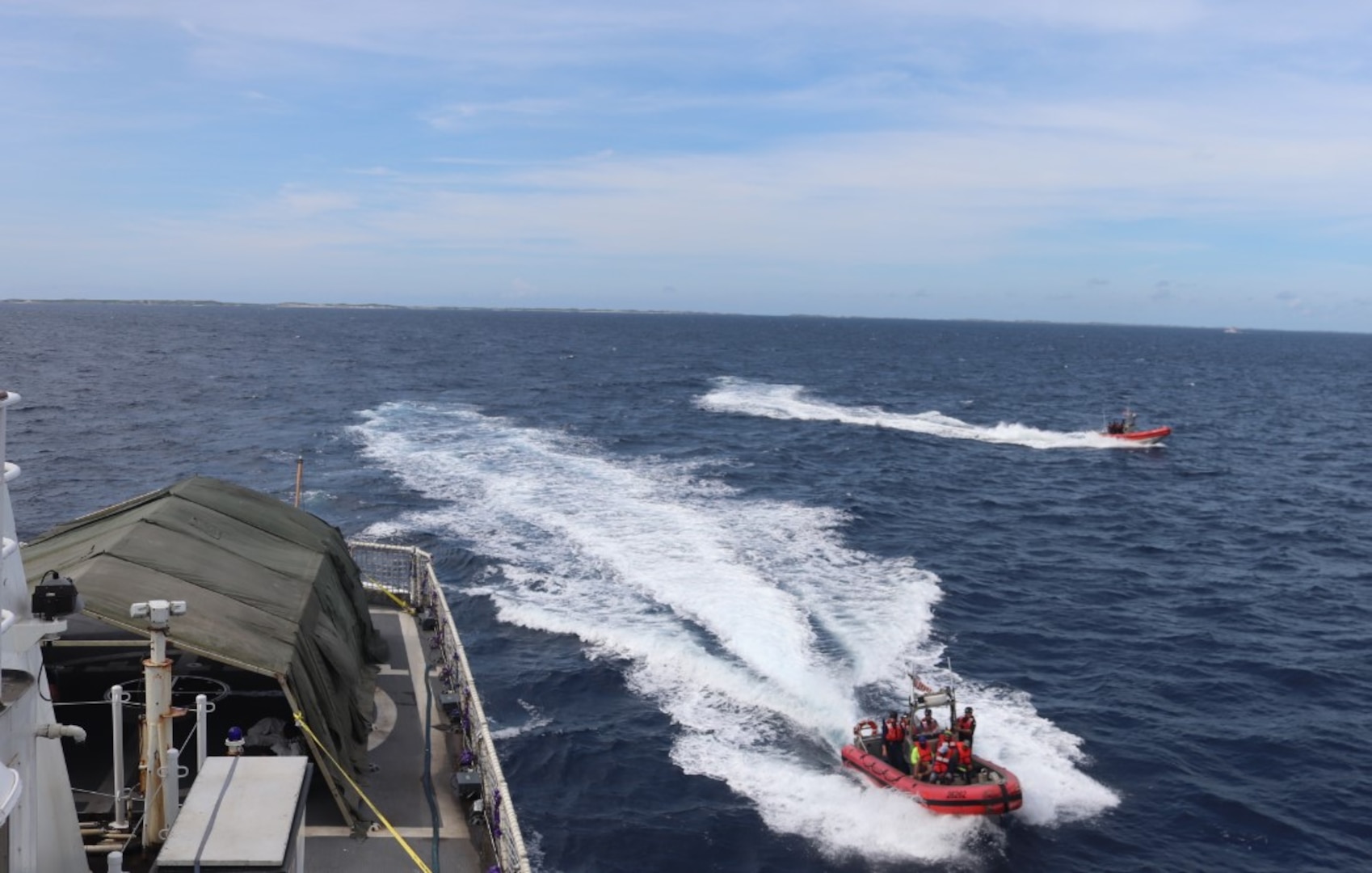 Coast Guard Cutter Vigilant (WMEC 617) works alongside Coast Guard Cutter Charles Sexton (WPC 1108) during a transfer of rescued migrants, Oct. 8, 2024, while underway in the Cay Sal Bank region. Vigilant's crew conducted a 54-day patrol in the Florida Straits and Caribbean Sea. (U.S. Coast Guard photo by Petty Officer 2nd Class Evan Tellado.)