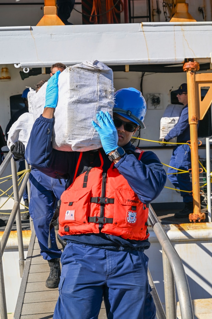 Crewmembers from Coast Guard Cutter Vigilant offload more than 1,510 pounds of cocaine and 1,470 pounds of marijuana with a combined value of approximately $18.5 million in Port Everglades, Florida, November 22, 2024. During the Vigilant’s 54-day patrol, Coast Guard crews, working alongside interagency and international partners, seized the illegal drugs in the international waters of the Caribbean Sea during two separate interdictions. (U.S. Coast Guard photo by Petty Officer 3rd Class Eric Rodriguez.)