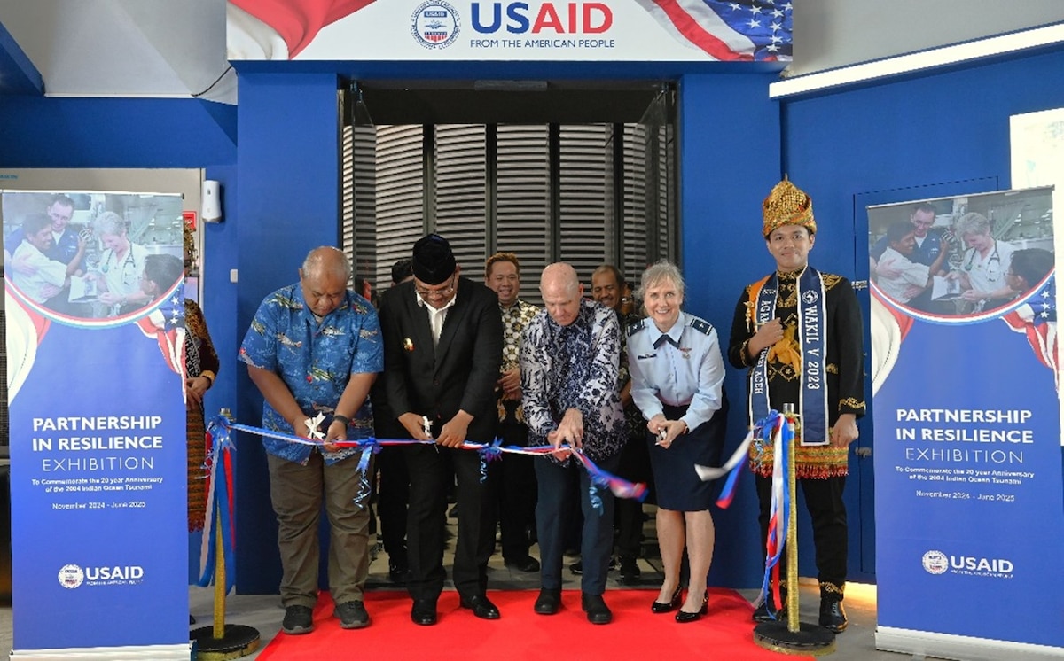 U.S. Air Force Brig Gen Carla Riner, Air National Guard advisor to the Pacific Air Forces Director of Air and Cyberspace Operations, cuts a ribbon alongside the U.S. delegation at the Aceh Tsunami Museum exhibit opening ceremony in Banda Aceh, Indonesia, Nov. 10, 2024. A 9.0 magnitude earthquake in the Indian Ocean caused a tsunami that destroyed multiple cities in Aceh Province, killing more than 100,000 people on Dec. 26, 2004. In response, U.S. Indo-Pacific Command executed Operation Unified Assistance which involved the deployment of 16,000 personnel, 26 ships, 58 helicopters, and 43 fixed-wing aircraft to deliver 18 million pounds of relief supplies, 400,000 gallons of fresh water, ferrying 8,000 people to safety, and providing direct medical treatment to over 20,000 people. (USAID courtesy photo)