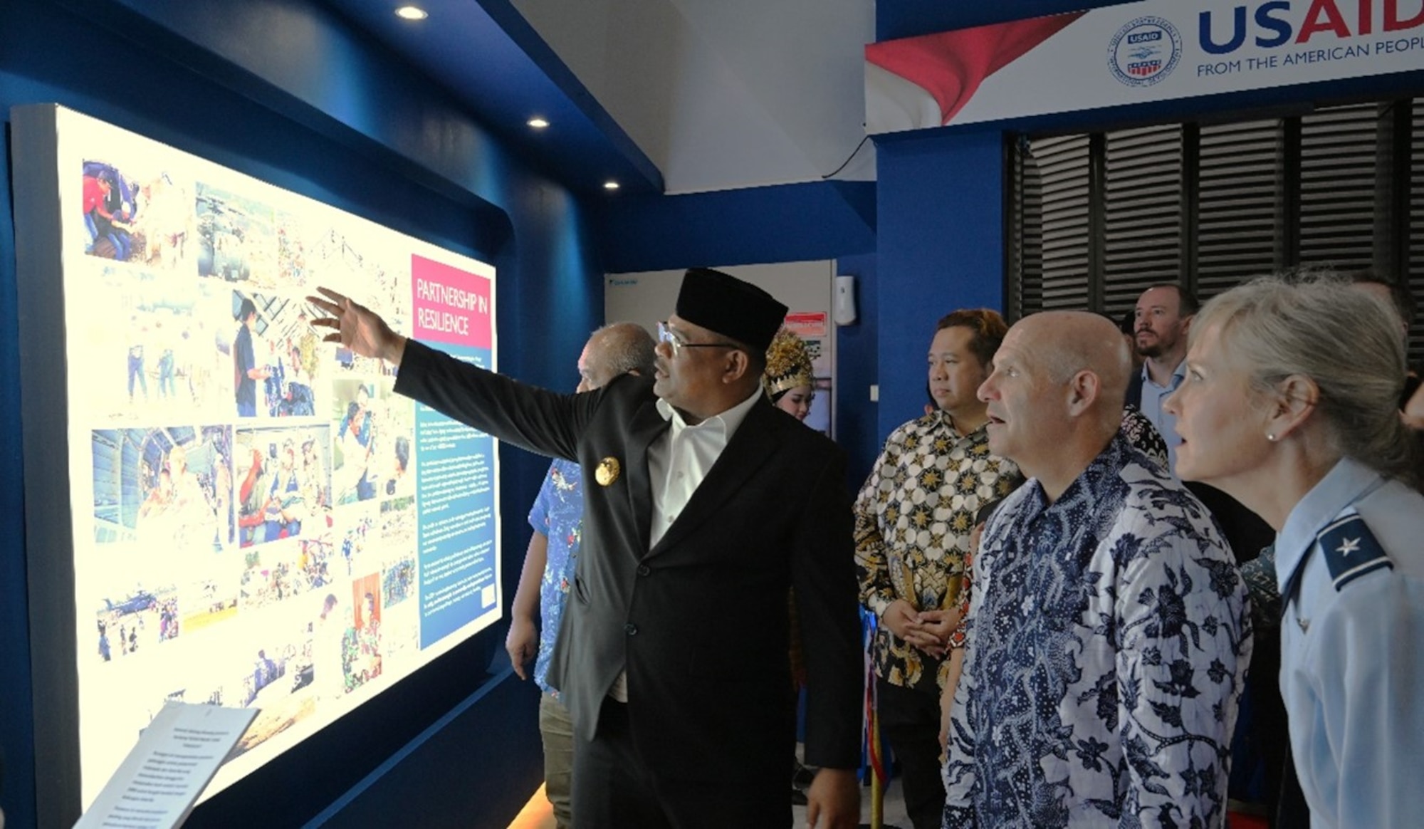 U.S. Air Force Brig Gen Carla Riner, Air National Guard advisor to the Pacific Air Forces Director of Air and Cyberspace Operations, tours the new exhibit honoring U.S. support in disaster relief with the Acting Governor of Aceh Province and the USAID-Jakarta Mission Director at the Aceh Tsunami Museum opening ceremony in Banda Aceh, Indonesia, Nov. 10, 2024.  The Indonesian Government requested international disaster relief within 24 hours of the tsunami hitting Banda Aceh. U.S. Indo-Pacific Command responded immediately by initiating Operation Unified Assistance. The operation last over 3 months and saved thousands of lives. The U.S.-Indonesian comprehensive strategic partnership continues to grow today. With over 220 collaborative events annually, the U.S. remains committed to supporting Indonesia and all partnered countries, in military and humanitarian efforts with the goal of ensuring a free and open Indo-Pacific. (USAID courtesy photo)