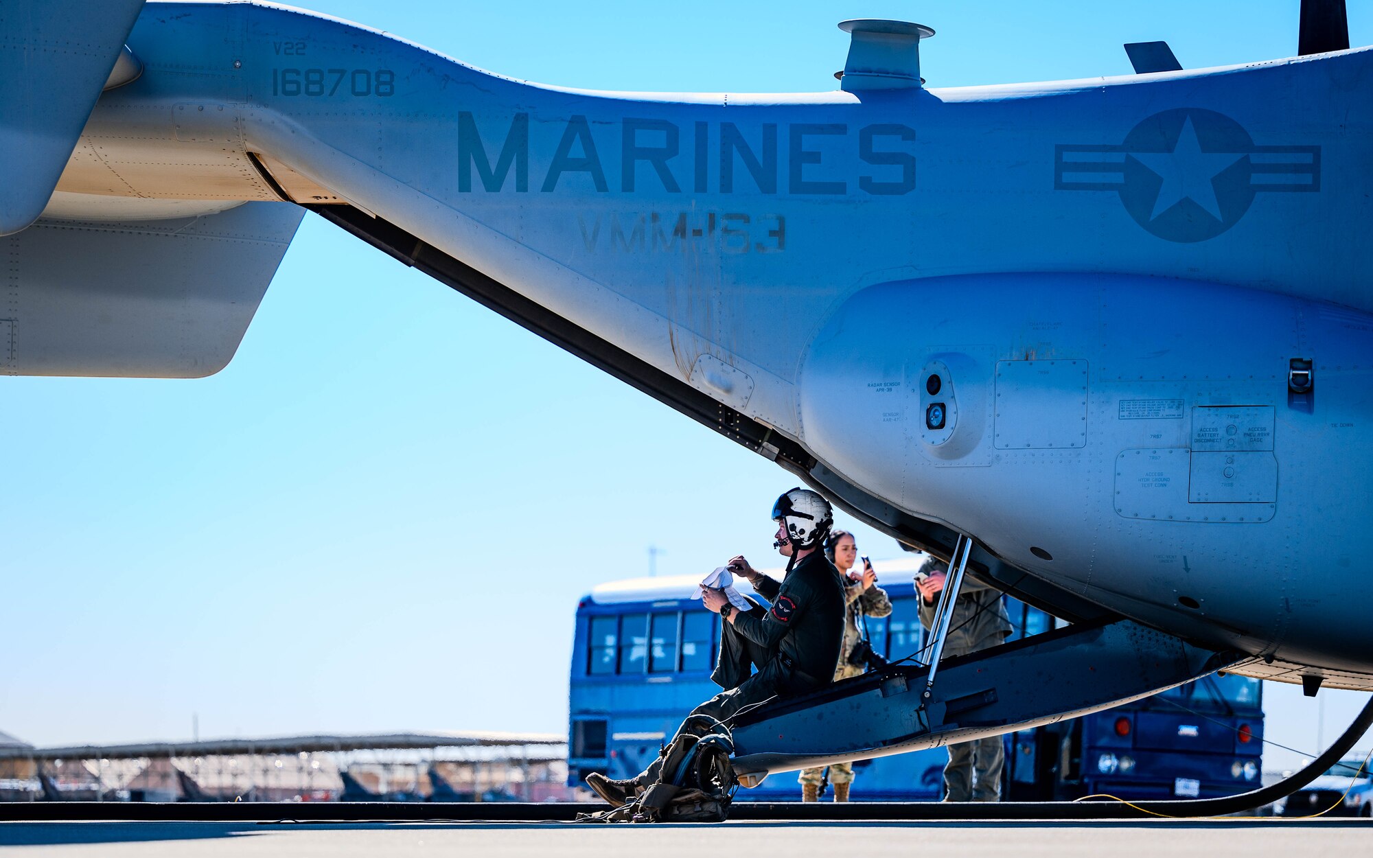 U.S. Marine Corps Cpl. Tyler Buer, Marine Medium Tiltrotor Squadron 163, Marine Aircraft Group 16, 3rd Marine Aircraft Wing, MV-22 Tiltrotor Crew Chief, conducts routine post-flight inspections following a landing.