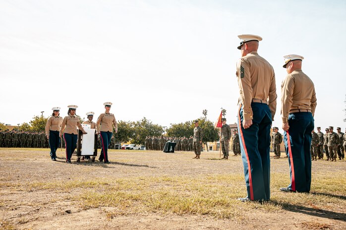 U.S. Marine Corps Col. Jason Freeby, commanding officer of Headquarters and Service Battalion, Marine Corps Recruit Depot San Diego, far right, and Sgt. Maj. Thomas A. Bachman, sergeant major of Headquarters and Service Battalion, MCRD San Diego, front right, are presented with the cake for a cake cutting ceremony at MCRD San Diego California, Nov. 6, 2024. The annual cake cutting ceremony is a long-standing tradition that celebrates the establishment of the United States Marine Corps. The Marine Corps birthday, on Nov. 10, 1775, is celebrated every year to commemorate the birth of the Corps and honor the service of all Marines, past and present. (U.S. Marine Corps photo by Cpl. Sarah M. Grawcock)