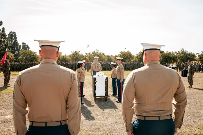 The Commanding Officer of Headquarters and Service Battalion, Marine Corps Recruit Depot San Diego, U.S. Marine Corps Col. Jason Freeby, right, and the Sergeant Major of Headquarters and Service Battalion, Sgt. Maj. Thomas A. Bachman, left, are presented with the cake for a cake cutting ceremony at MCRD San Diego California, Nov. 6, 2024. The annual cake cutting ceremony is a long-standing tradition that celebrates the establishment of the United States Marine Corps. The Marine Corps birthday, on Nov. 10, 1775, is celebrated every year to commemorate the birth of the Corps and honor the service of all Marines, past and present. (U.S. Marine Corps photo by Cpl. Sarah M. Grawcock)