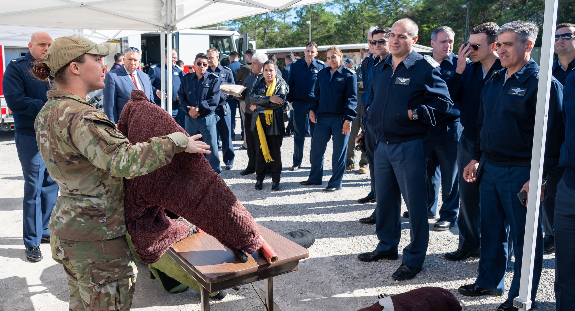 U.S. Air Force Staff Sgt. McKenzie Langan, 96th Security Forces Squadron military working dog trainer, explains the purpose of a bite suit