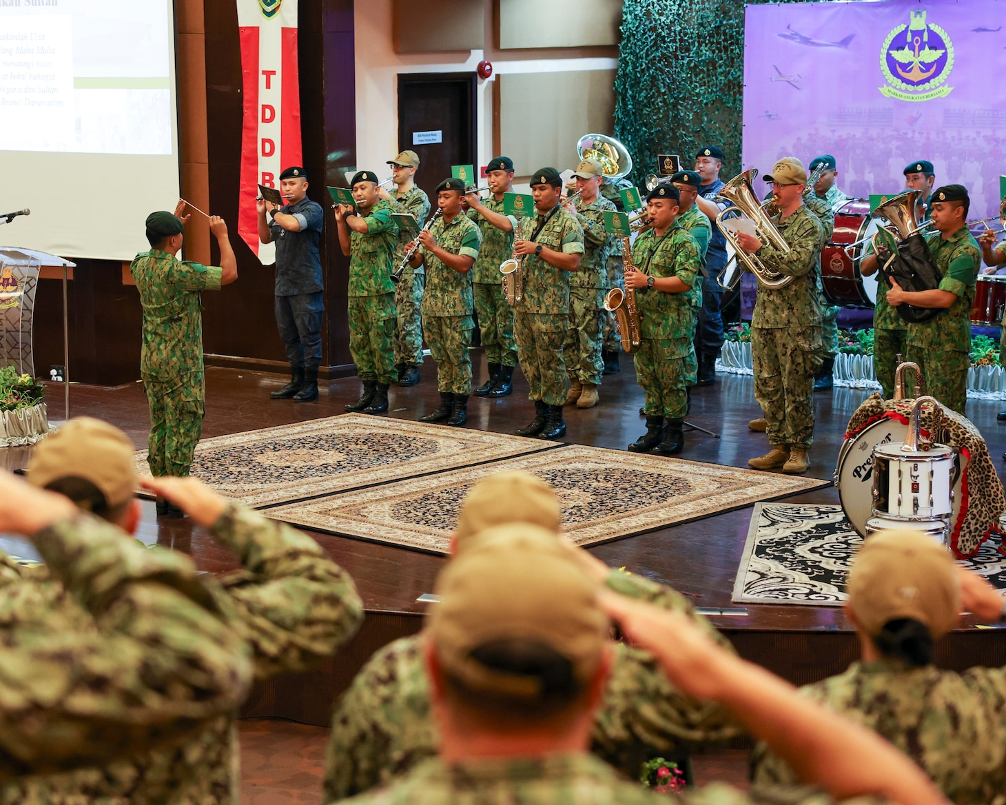 BANDAR SERI BEGAWAN, Brunei (Nov. 25, 2024) – Sailors assigned to the U.S. 7th Fleet Band perform alongside the Royal Brunei Armed Forces Band during the closing ceremony of Cooperation Afloat Readiness and Training (CARAT) Brunei 2024 at Wira Seni Hall, RBAF Band, Bolkiah Garrison, Brunei, Nov. 25. This year marks the 30th iteration of CARAT, a multinational exercise series designed to enhance U.S. and partner navies’ abilities to operate together in response to traditional and non-traditional maritime security challenges in the Indo-Pacific region. (U.S. Navy Photo by Mass Communication Specialist 2nd Class Zachary Grooman)