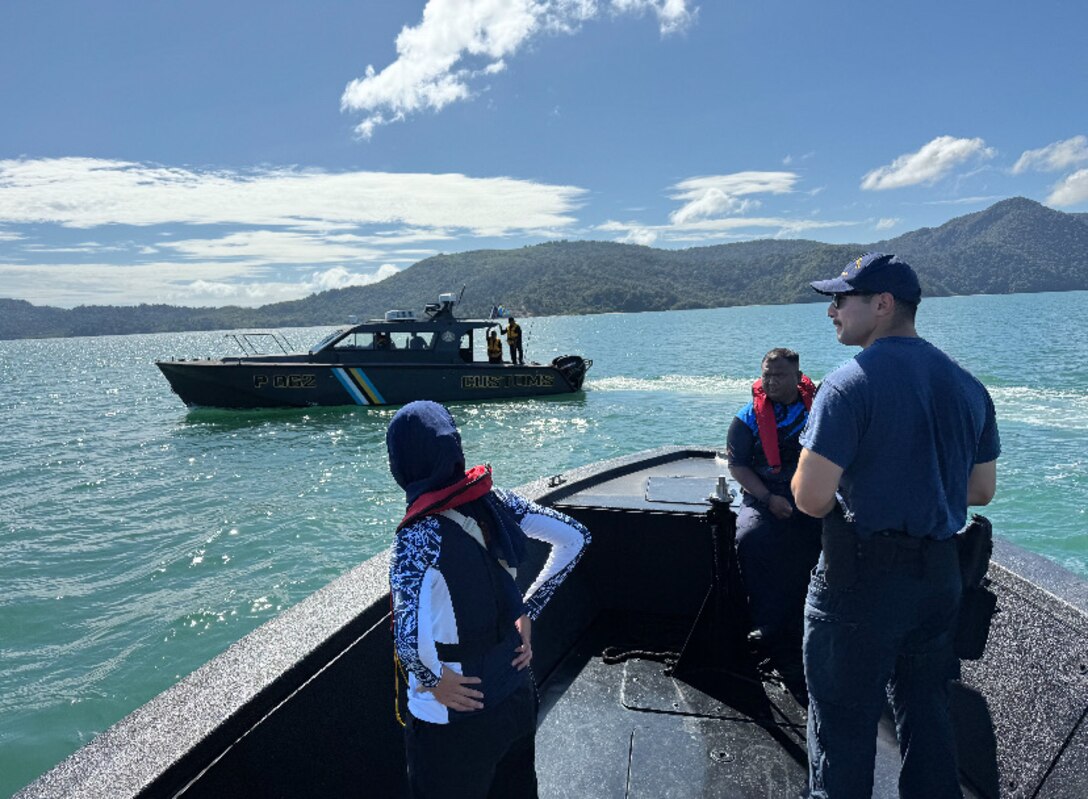 U.S. Coast Guard Maritime Safety and Security Team Los Angeles Long Beach members and Royal Malaysian Customs Academy members conduct underway training aboard Royal Malaysian customs and police small boats in Langkawi, Malaysia to support subject matter expert exchange program, Nov. 8, 2024. The goal of the exchange was to assist in improving operations, inter-agency cooperation and proficiency in law enforcement and maritime operations. (U.S. Coast Guard photo by Petty Officer First Class Richie Pilozo.)