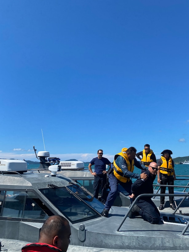 U.S. Coast Guard Maritime Safety and Security Team Los Angeles Long Beach members and Royal Malaysian Customs Academy members conduct underway law enforcement training aboard a Royal Malaysian customs and police small boat in Langkawi, Malaysia to support subject matter expert exchange program Nov. 7, 2024. The goal of the exchange was to assist in improving operations, inter-agency cooperation and proficiency in law enforcement and maritime operations. (U.S. Coast Guard photo by Lt j.g. Michael Vojvodich.)