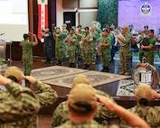 Sailors assigned to the U.S. 7th Fleet Band perform alongside the Royal Brunei Armed Forces Band during the closing ceremony of Cooperation Afloat Readiness and Training (CARAT) Brunei 2024 at Wira Seni Hall, RBAF Band, Bolkiah Garrison, Brunei, Nov. 25.