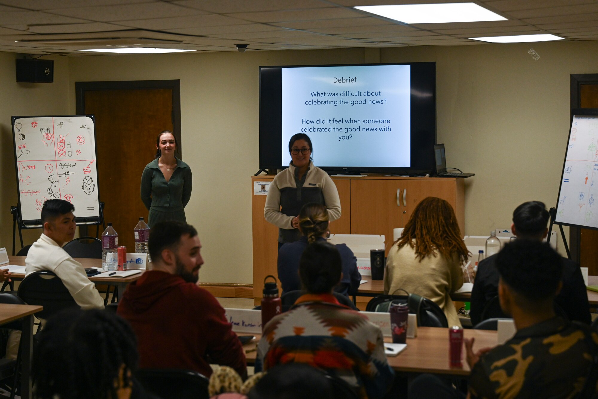 U.S. Air Force Staff Sgt. Allie Payne, left, and Tech. Sgt. Katlin Ayres, right, 8th Fighter Wing master resilience trainers, leads a class discussion during the first resilience training assistant course at Kunsan Air Base, Republic of Korea.