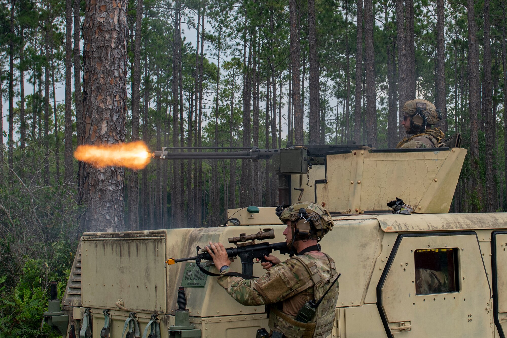 Airman fires heavy weapon from tactical vehicle