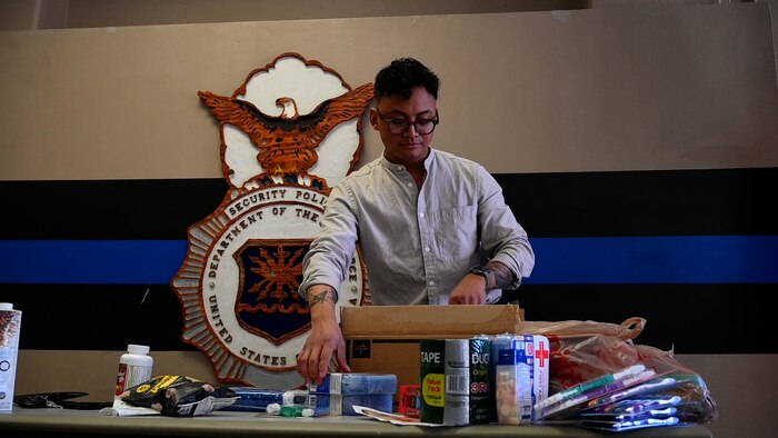 A person packing a box
