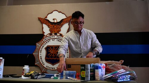 A person packing a box