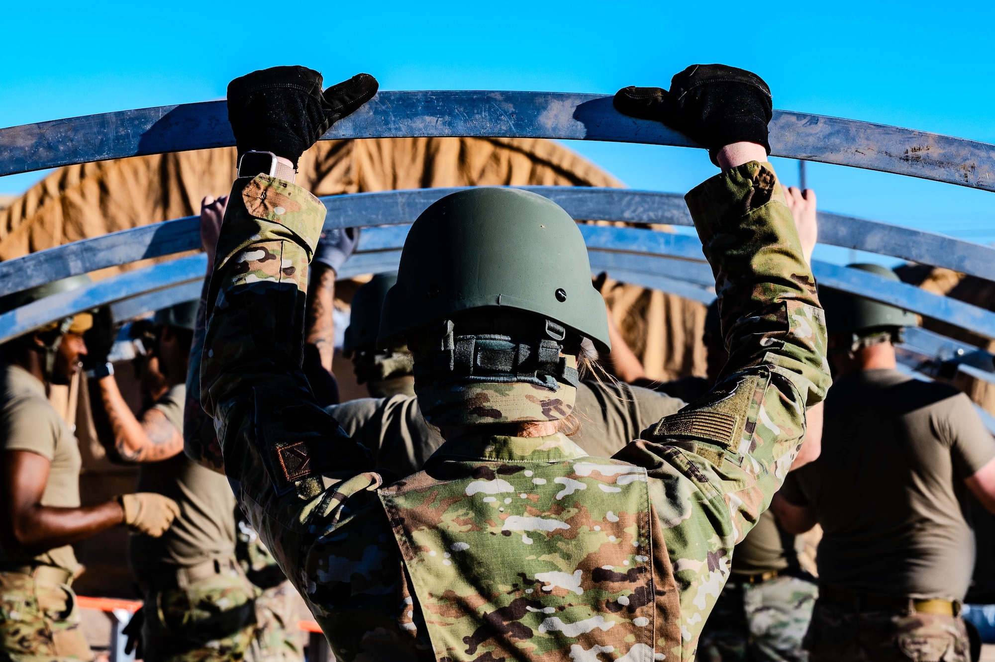 U.S. Air Force Airmen assigned to the 56th Fighter Wing set up tents.