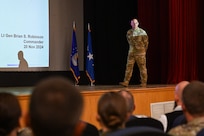 U.S. Air Force Lt. Gen. Brian S. Robinson, commander of the Air Education and Training Command (AETC), holds an all-call at Altus Air Force Base, Oklahoma, Nov. 20, 2024. Robinson shared upcoming changes as AETC transitions to the Airman Development Command in 2025. (U.S. Air Force photo by Airman 1st Class Jonah Bliss)